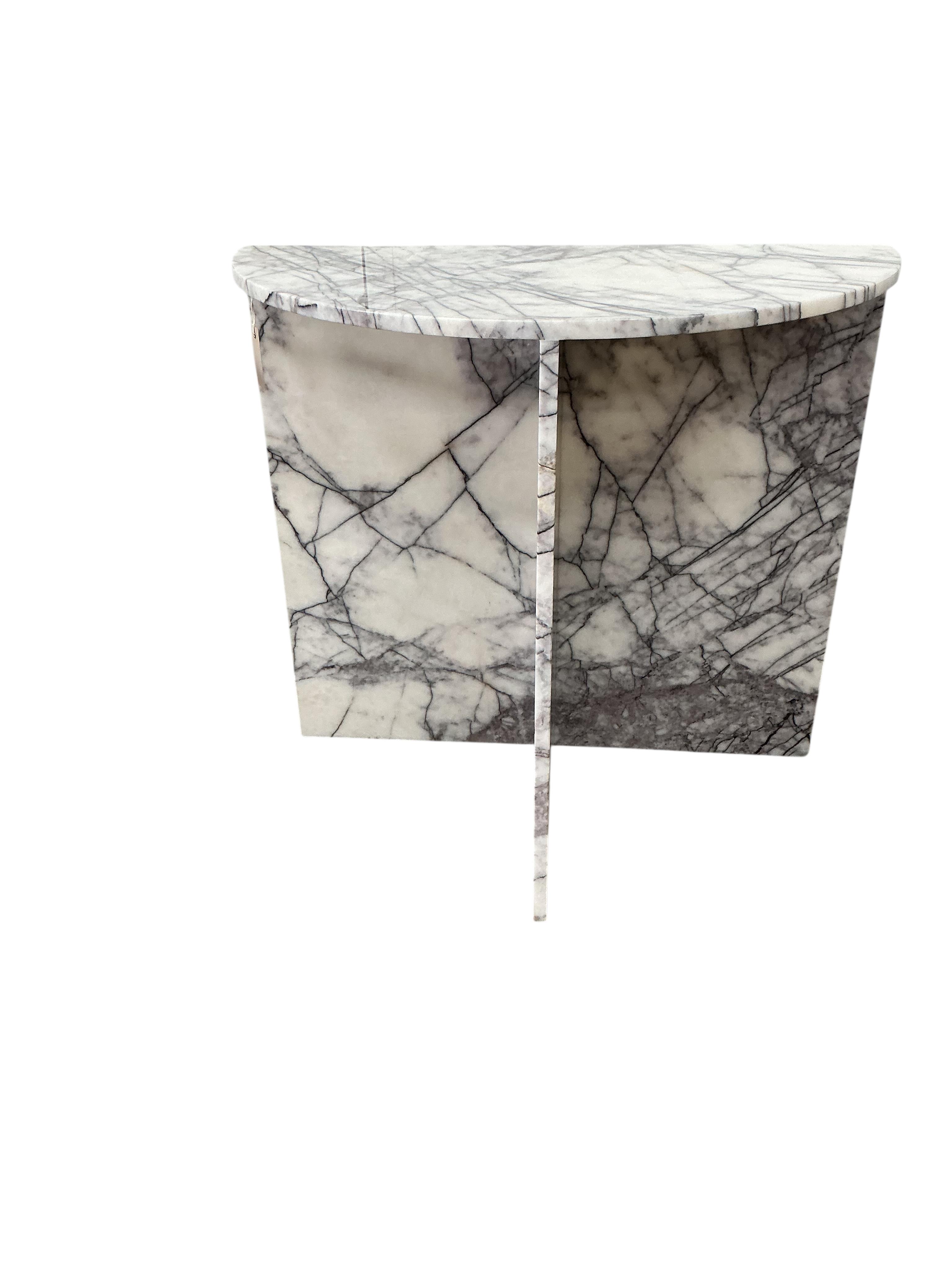 A near pair of reconstituted marble demi lune console tables, width 80cm, depth 42cm, height 75cm